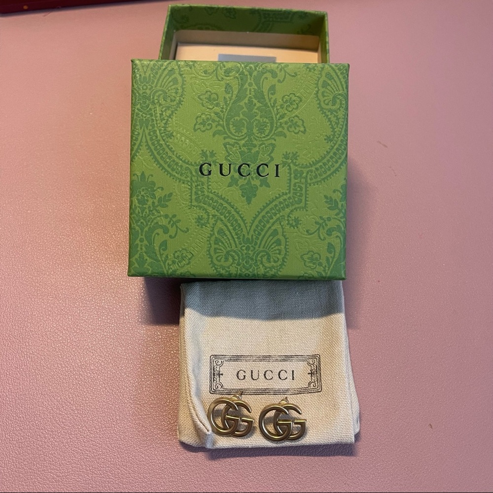 Gucci gold running g stud earrings